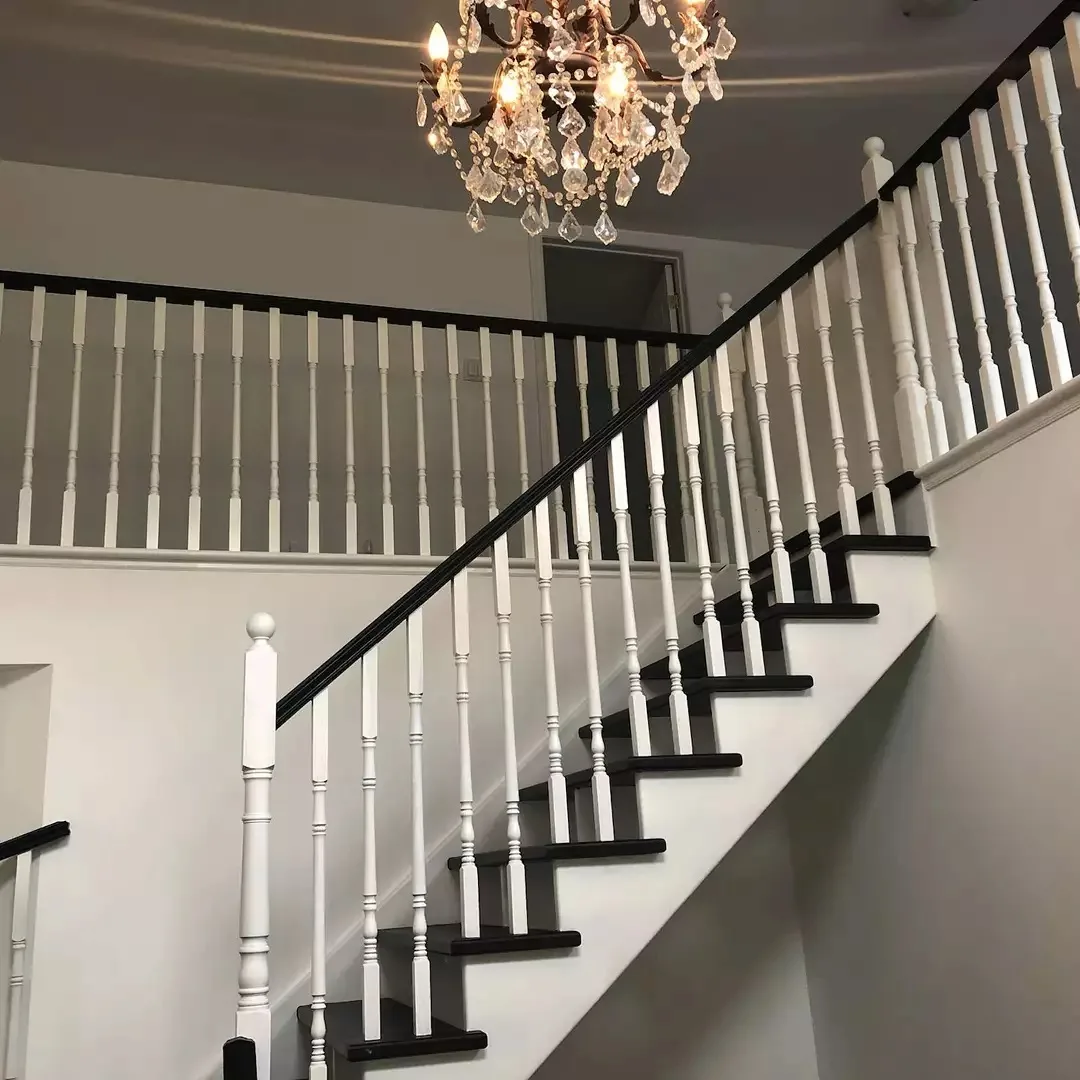 A TAG-finished staircase with white spindles, dark treads and handrails